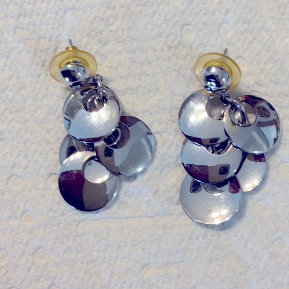 Silver plated earrings that are 2 inches long and in great condition.